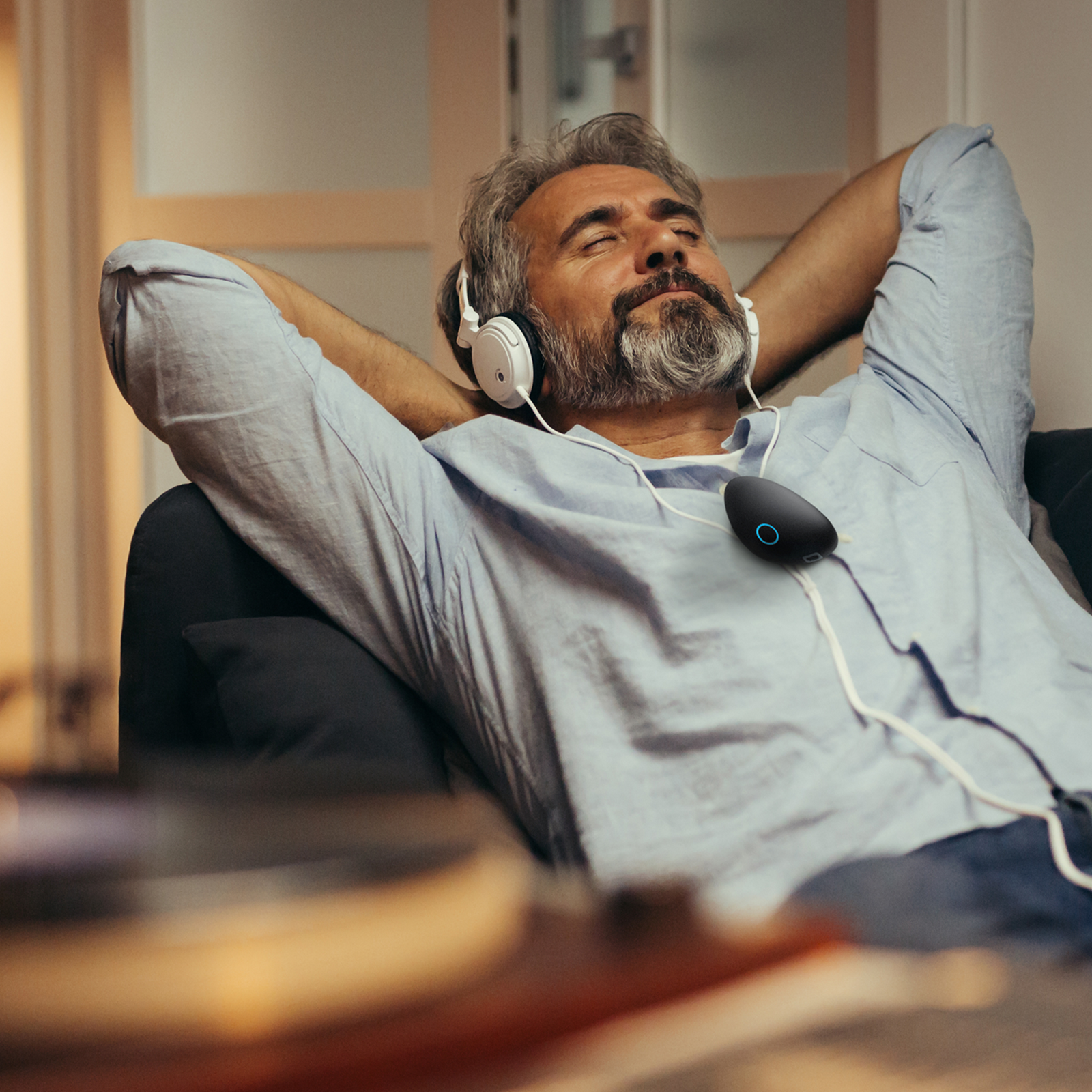 Person relaxing with the Sensate device resting on their chest